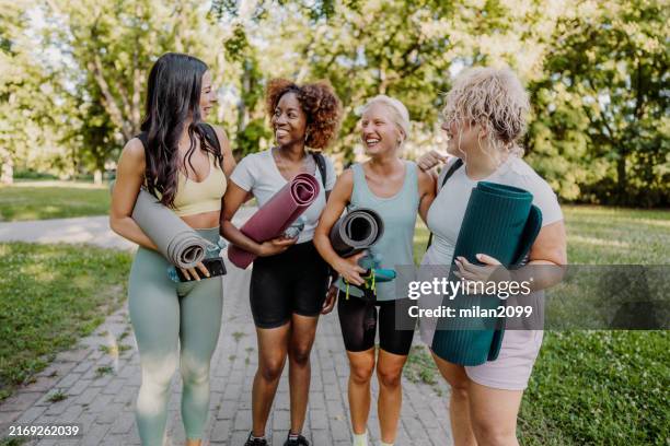 Group of women practicing yoga in the park